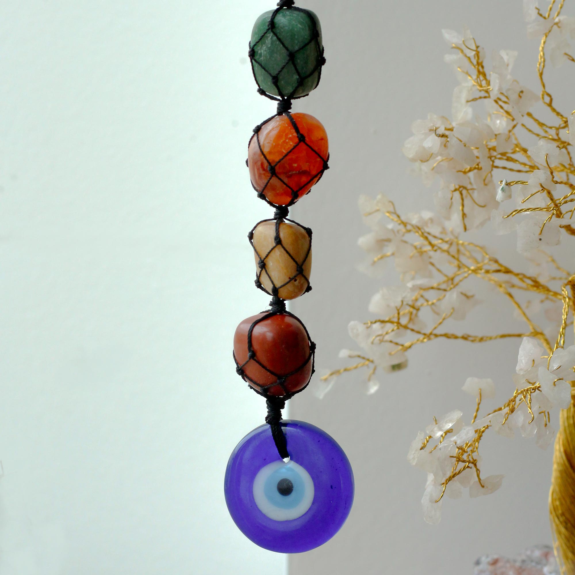 Second image of Colgante Piedra Chakra - Mal de Ojo